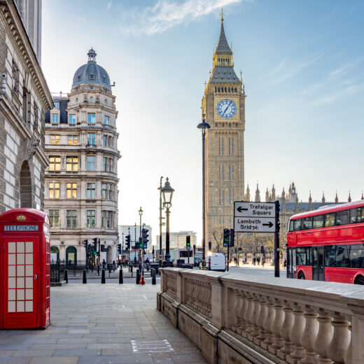 Big Ben with a red phone box and double-decker bus in London